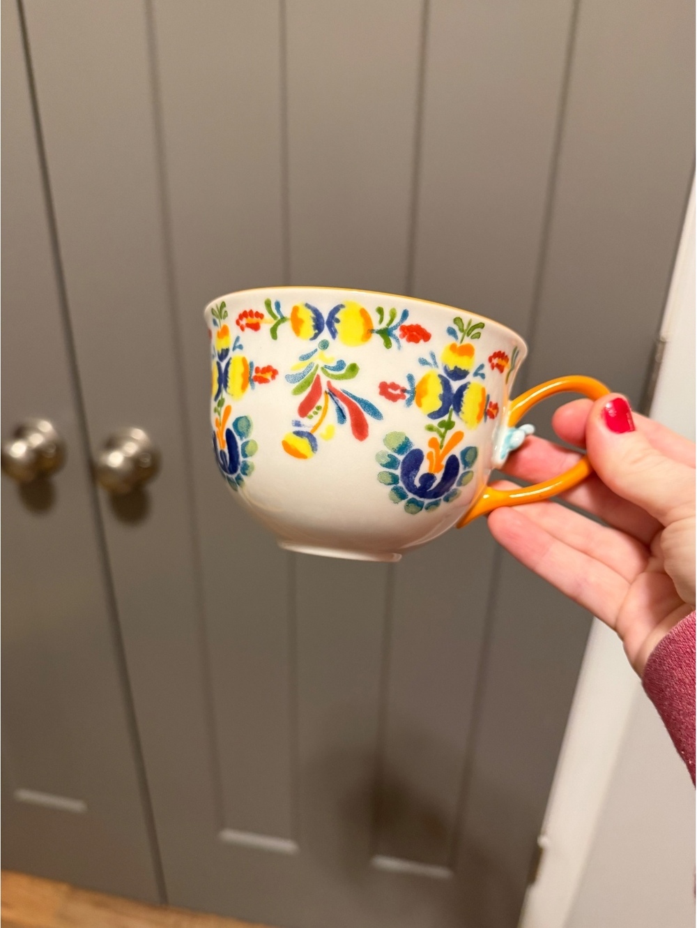 Hand-Painted Floral Ceramic Cup with Orange Handle